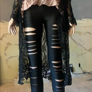 Black shiny cutout leggings. Size small